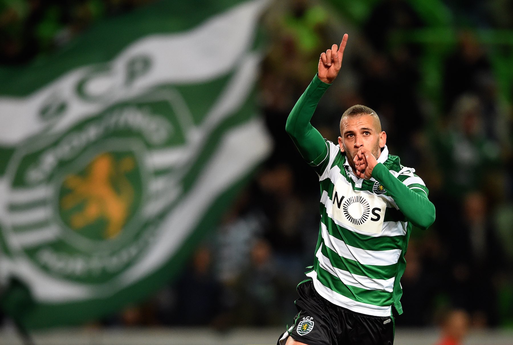 Sporting's Algerian forward Islam Slimani celebrates after scoring the opening goal during the Portuguese League football match Sporting CP vs FC Porto at Alvalade stadium in Lisbon on January 2, 2016.   AFP PHOTO/ FRANCISCO LEONG / AFP / FRANCISCO LEONG        (Photo credit should read FRANCISCO LEONG/AFP/Getty Images)